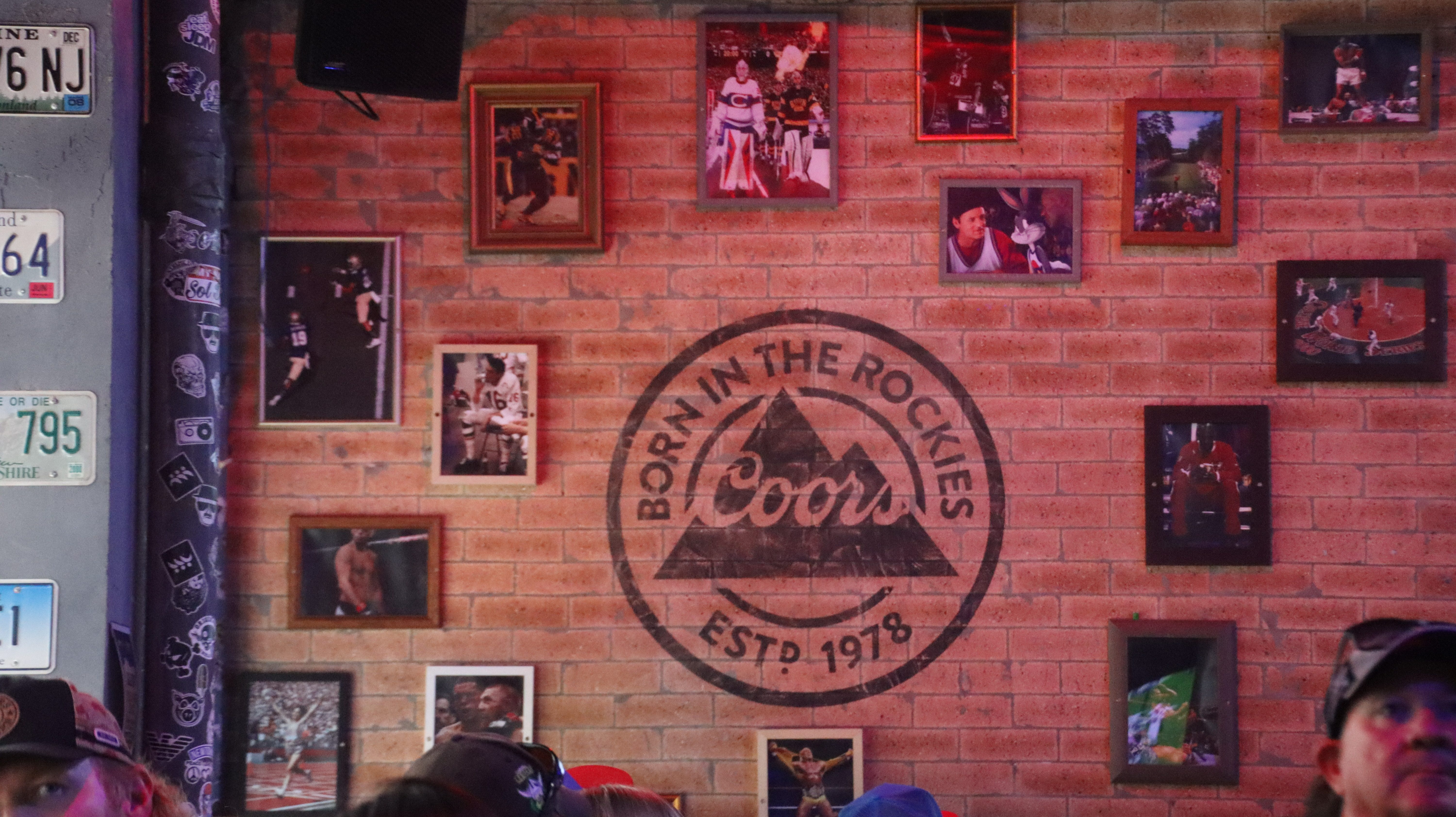 Wall of framed vintage sports photos